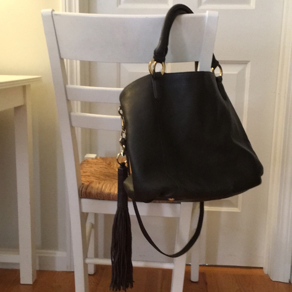 Brown leather. Detachable tassel, strap